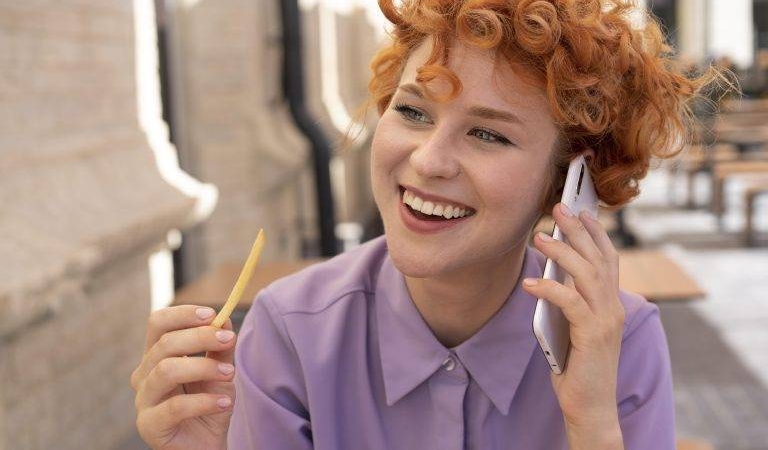 close-up-smiley-woman-talking-phone-768x512