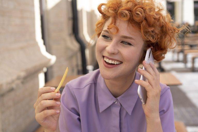 close-up-smiley-woman-talking-phone-768x512