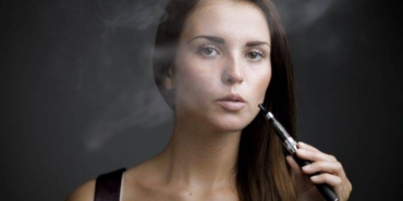 elegant-woman-smoking-e-cigarett-768x512