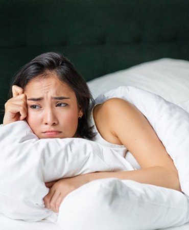 sad-and-gloomy-asian-girl-lying-in-her-bed-grimac-2023-11-27-05-07-12-utc-768x512
